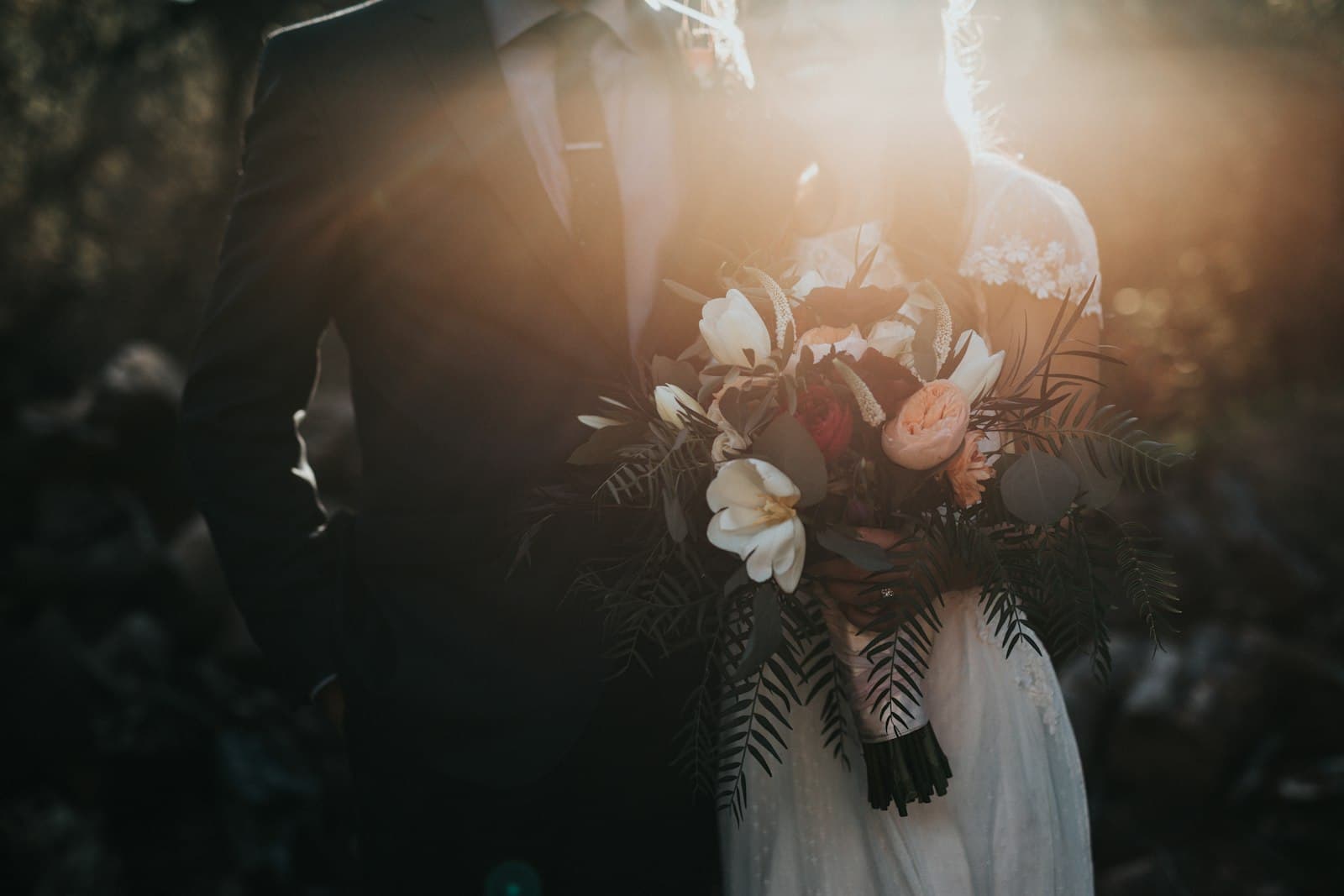A bride holding a garden-style bridal bouquet